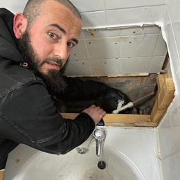 Gas Safe registered engineer working on a gas connection